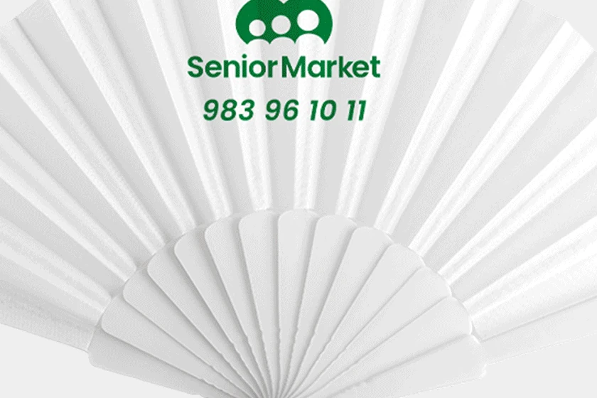 Branded folding hand fan printed with the Senior Market logo and phone number
