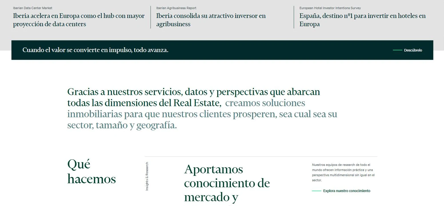 CBRE Spain services section with a large two-tone statement paragraph above a Que hacemos editorial grid