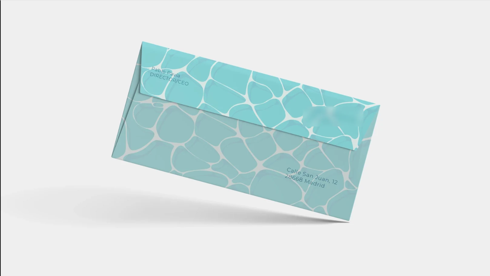 WaveWear envelope printed edge to edge in the seafoam cell pattern with the return address in deep teal